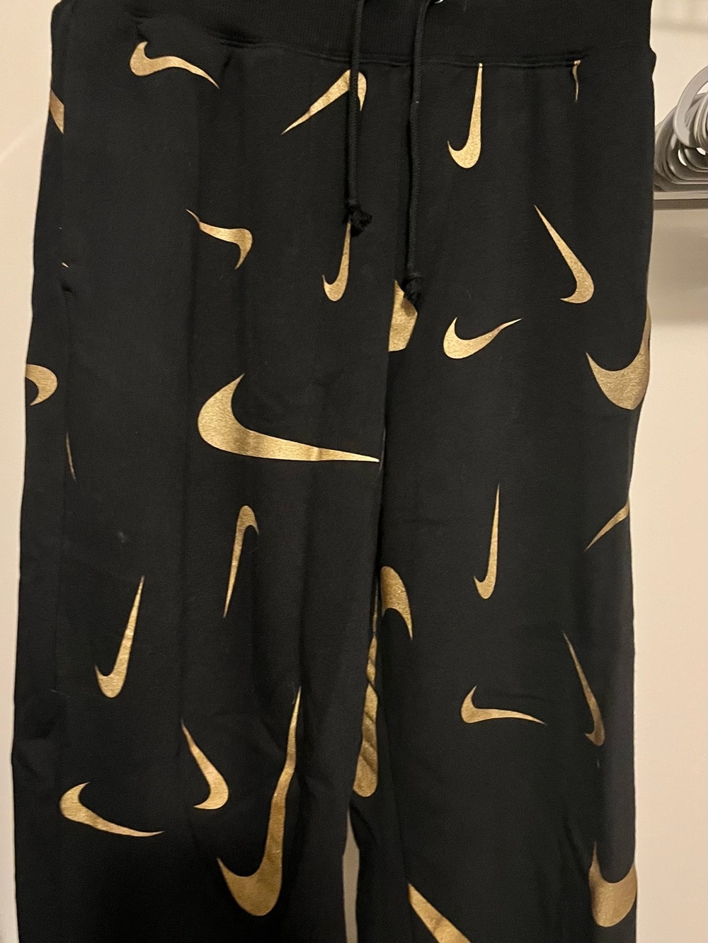 Excellent Condition Nike Women Black Joggers with Gold Swoosh Print size Smal